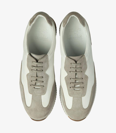 A bird's-eye view of a pair of Loake Linford White-Grey Leather Trainers, perfectly aligned to show the symmetrical design, the premium calf leather, and the attention to detail in the stitching and finish.