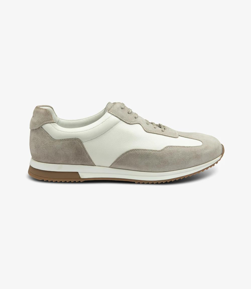 A side view of the Loake Linford White-Grey Leather Trainer, showcasing its sleek and stylish design with a blend of white and grey premium calf leather, and a clean, streamlined silhouette.
