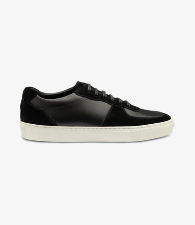 A sleek black sneaker crafted from premium calf leather and suede, featuring a rounded toe and side-stitch cup rubber soles for durability and grip.