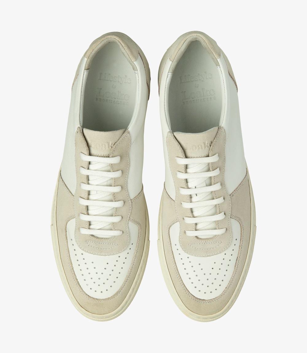 From above, the Loake Rush White and Sand Sneakers display their exquisite craftsmanship and stylish design. The harmonious blend of white leather and sand suede, combined with clean lines, makes these trainers a standout choice for any casual ensemble.