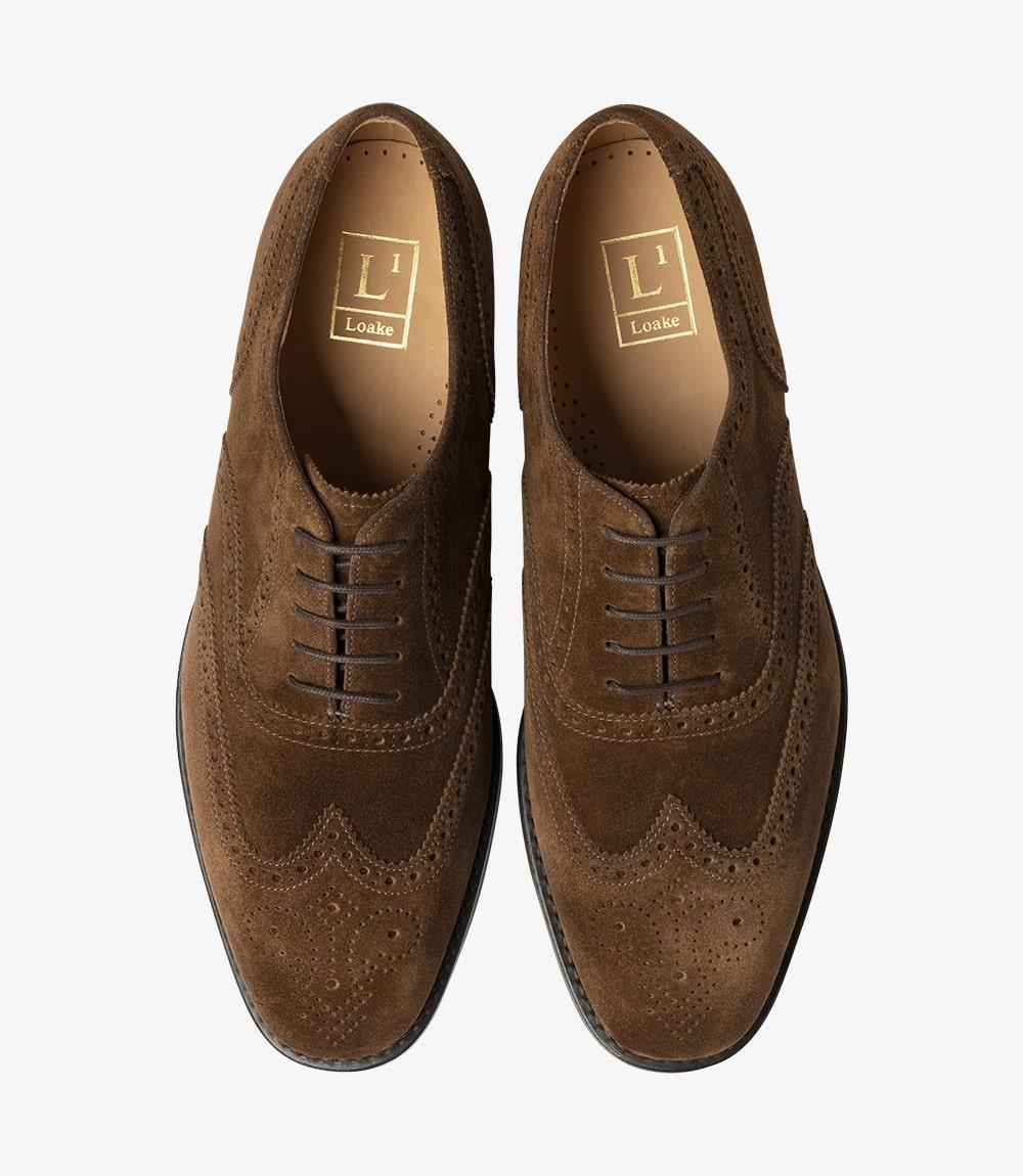 A top-down view of two Loake 302 Brown Leather Oxford Brogues, perfectly symmetrical in design and craftsmanship. The combination of leather and suede detailing is evident, showcasing the meticulous attention to detail and quality construction of each pair.