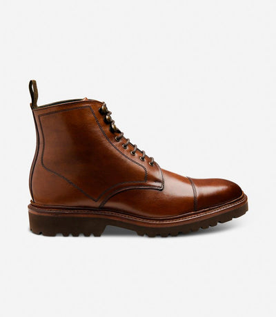 The Loake Aquarius Cedar Derby Boot presents a sleek profile, showcasing its hand-painted cedar leather construction and robust commando rubber sole, ensuring both style and durability.