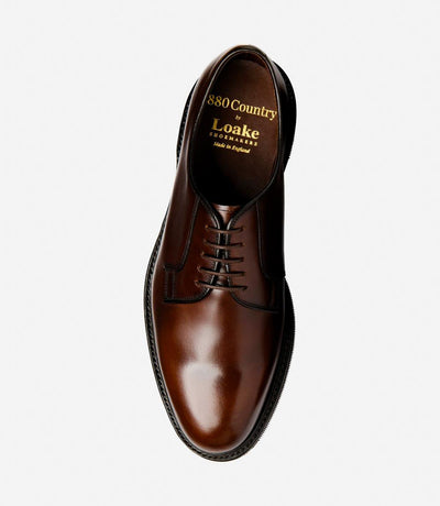 A top-down view of Loake Leyburn Dark Brown Derby Toe Cap shoes, perfectly symmetrical in design and craftsmanship. The hand-painted leather and classic derby styling are evident, reflecting the quality and attention to detail in each pair.