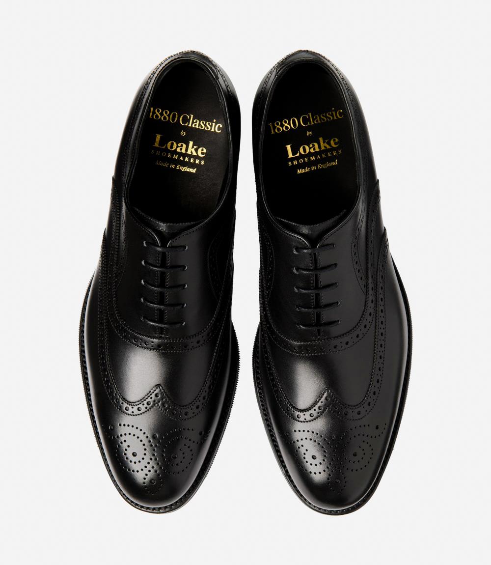 Displays both shoes together, offering a full perspective of their matching design. The photo highlights the symmetry and elegant appearance of the Castlegate brogues, perfect for a sophisticated business look.