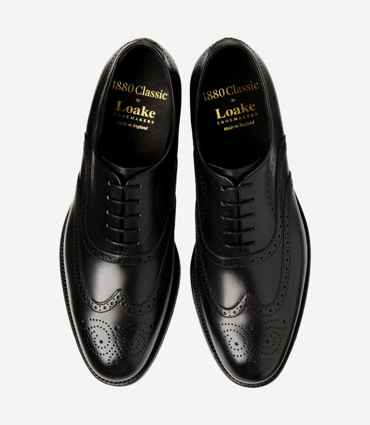 Displays both shoes together, offering a full perspective of their matching design. The photo highlights the symmetry and elegant appearance of the Castlegate brogues, perfect for a sophisticated business look.