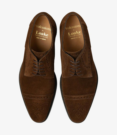 A bird's-eye view of the two Eldon shoes showcases their harmonious symmetry and understated charm, with their semi-brogue design and rich brown suede, making them a versatile and stylish addition to any gentleman's wardrobe.