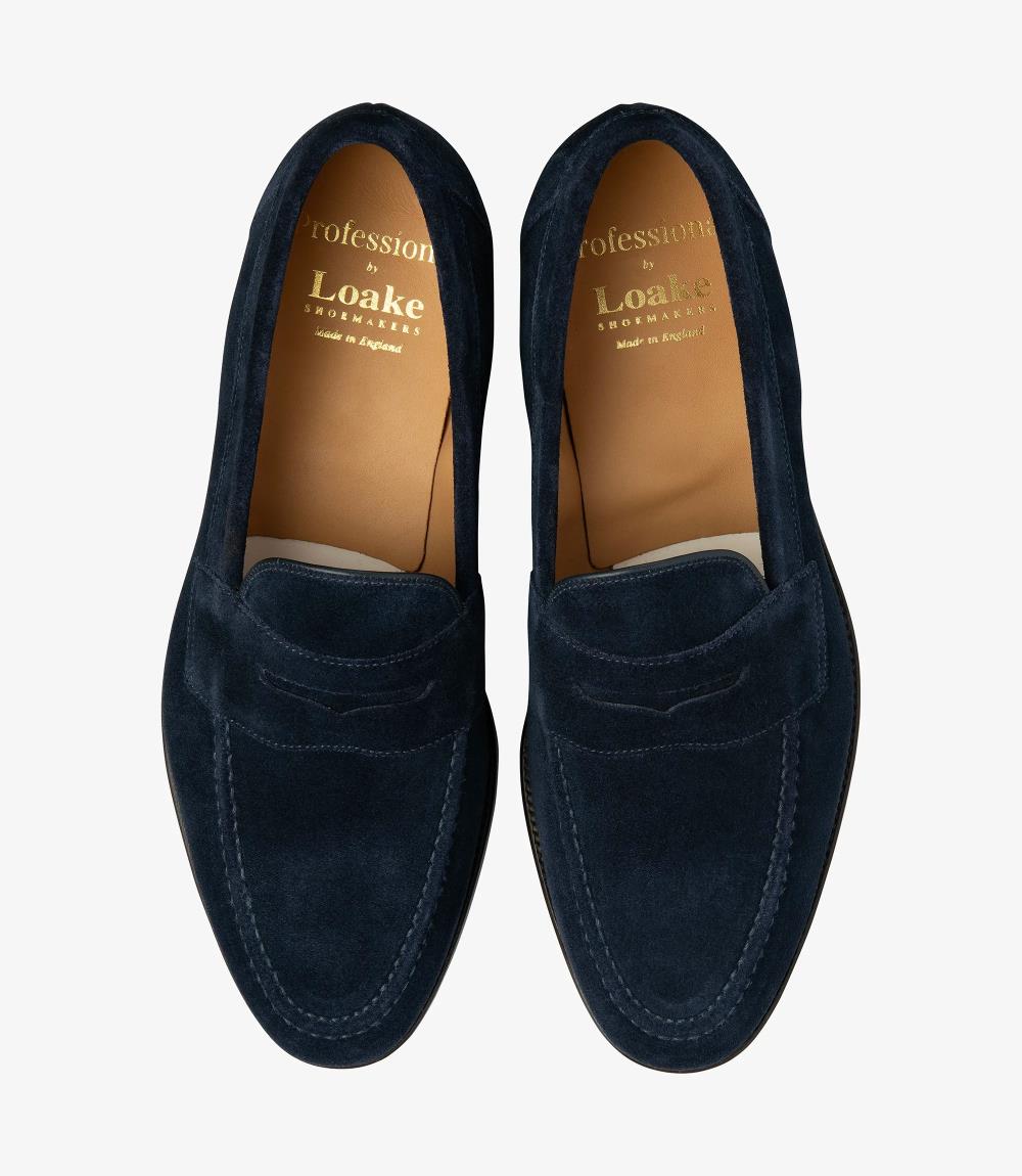 A bird's-eye view of the two Imperial loafers showcases their symmetrical beauty and understated charm, with their sleek design and luxurious suede finish, making them a versatile and stylish addition to any gentleman's footwear collection.