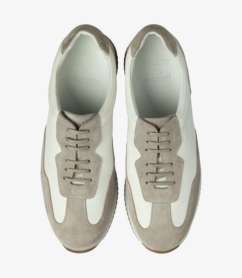 A bird's-eye view of a pair of Loake Linford White-Grey Leather Trainers, perfectly aligned to show the symmetrical design, the premium calf leather, and the attention to detail in the stitching and finish.