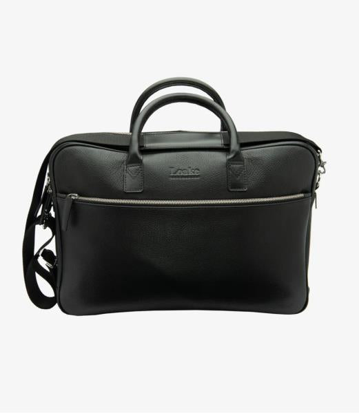 A sophisticated image of the Westminster Black Grain Leather Briefcase, showcasing its sleek black grain calf leather and elegant design. The briefcase features two external zippers and a detachable shoulder strap, all highlighted against a dark background to emphasize its refined texture and craftsmanship.