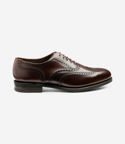 A side view of the Loake 302 Brown Leather Oxford Brogues, showcasing their sleek silhouette and polished leather upper. The Goodyear welted rubber soles provide durability and stability, while the brogue detailing adds a touch of classic charm.