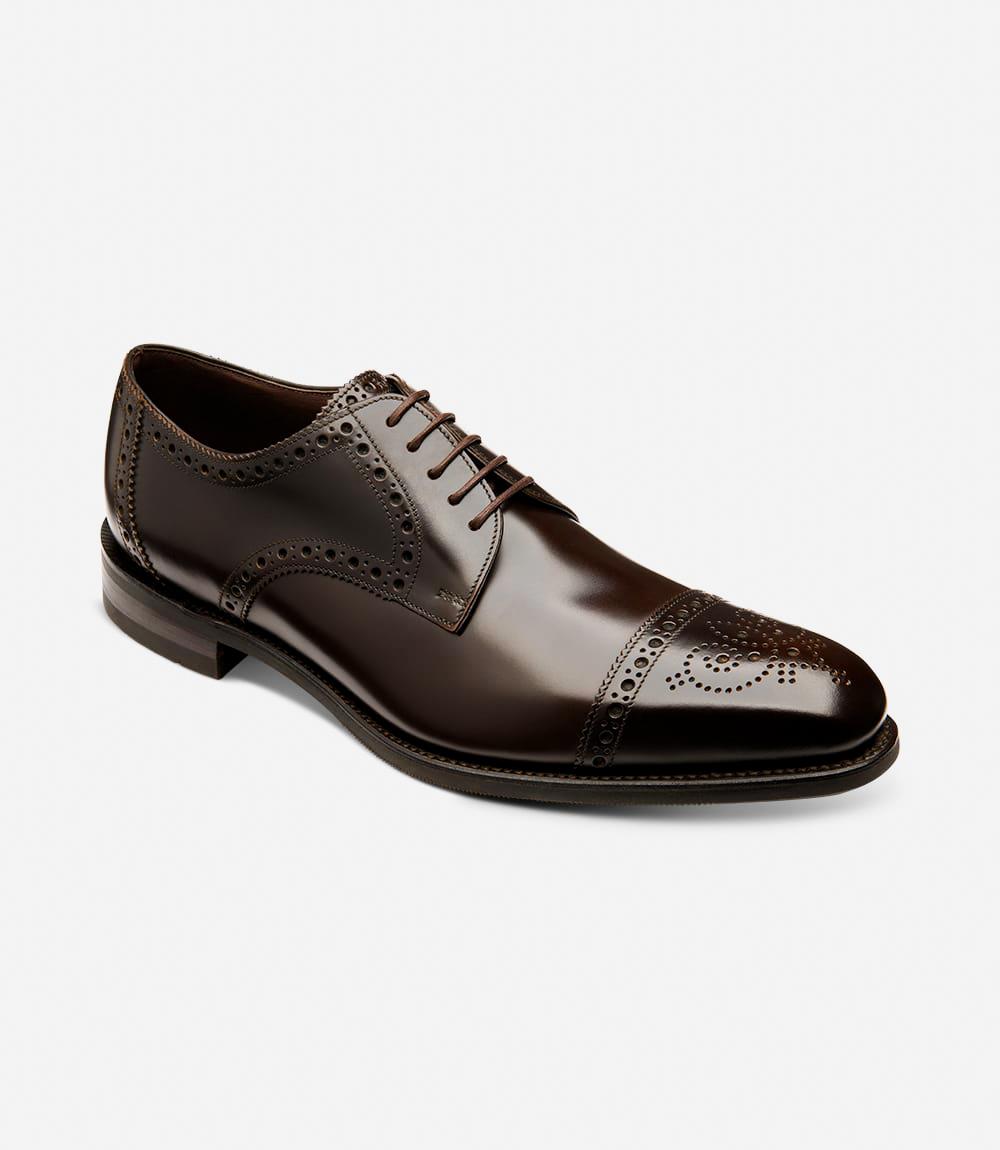 Captured from an angle, the outside profile of the Eldon reveals its exquisite craftsmanship and refined design, highlighting the rich dark brown hue and fine stitching, symbolizing classic elegance and versatility.
