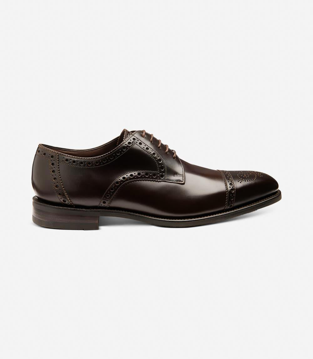 The outside profile of the Loake Eldon Dark Brown Derby Semi-Brogue showcases its sleek silhouette, featuring a straight toe-cap with subtle punched detailing, exuding timeless sophistication in premium calf leather.