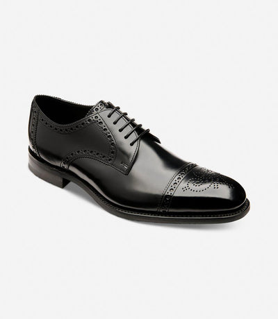 Captured from an angle, the outside profile of the Eldon reveals its fine craftsmanship and elegant design, highlighting the polished calf leather and Goodyear welted shadow rubber soles, symbolizing durability and style.
