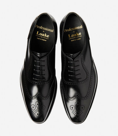 A bird's-eye view of the two Eldon shoes showcases their symmetrical beauty and timeless appeal, with their semi-brogue design and versatile black polished finish, making them the epitome of refined footwear for any occasion.