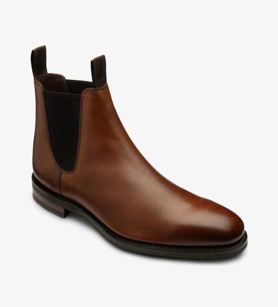 An angled shot capturing the dynamic lines and contours of the Loake Emsworth Cedar Chelsea Boot. The rich calf leather and Goodyear welted rubber soles are highlighted from this perspective, emphasizing both style and functionality.