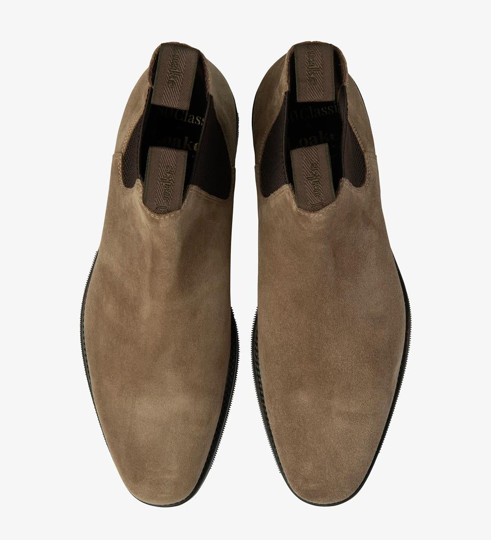 A top-down view of two Loake Emsworth Flint Suede Chelsea Boots, perfectly symmetrical in design and craftsmanship. The luxurious suede leather and meticulous stitching detail are evident, showcasing the impeccable quality of these British-made boots.