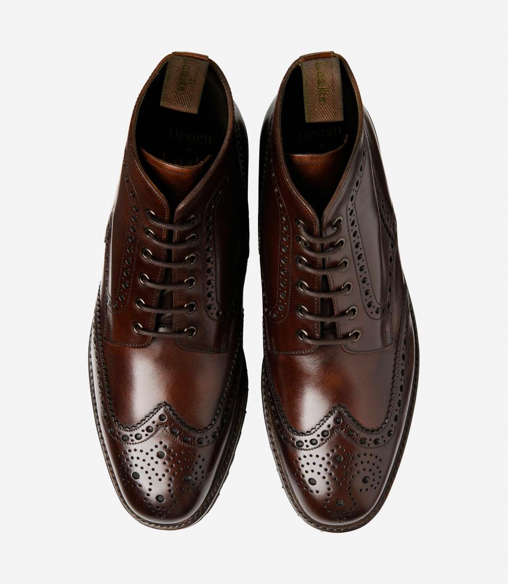 A bird's-eye view captures the symmetry and elegance of the Loake Pegasus Waxy Dark Brown Derby Full-Brogue Boots. The matching pair displays the intricate brogue detailing and hand-painted leather, making them perfect for both formal occasions and everyday wear.