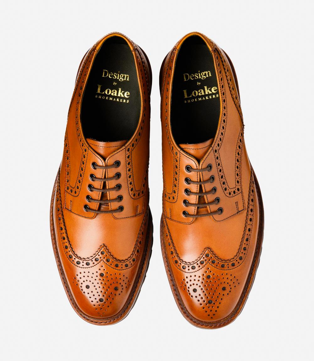 A bird's-eye view captures the symmetry and elegance of the Loake Perseus Tan Derby Full-Brogue. The matching pair displays the intricate brogue detailing and hand-painted leather, making them perfect for both formal occasions and everyday wear.