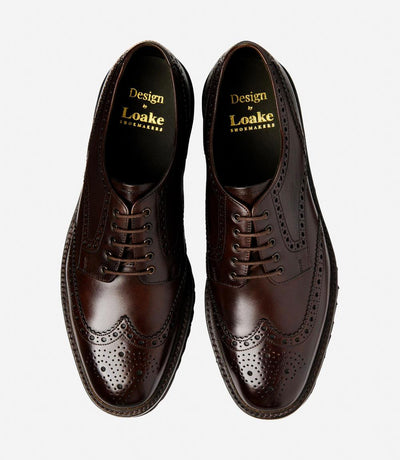 A bird's-eye view captures the symmetry and elegance of the Loake Perseus Dark Brown Derby Full-Brogue. The matching pair displays the intricate brogue detailing and hand-painted leather, making them perfect for both formal occasions and everyday wear.