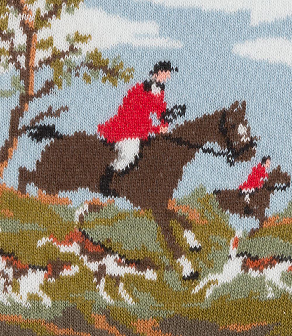 The brown background showcases a charming scene with horses and dogs