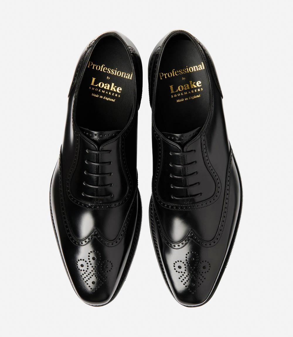 A bird's-eye view of the Loake Tay Black Polished Oxford Semi-Brogues reveals their symmetrical elegance and timeless appeal. The matching pair exudes sophistication with their polished leather construction and semi-brogue detailing. Designed for comfort and style, these shoes are perfect for the modern gentleman looking to make a lasting impression.