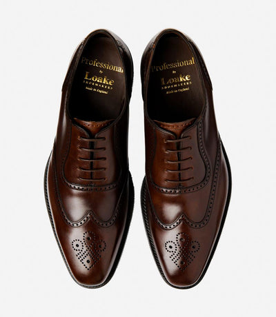 A bird's-eye view captures the symmetry and elegance of the Loake Tay Dark Brown Polished Oxford Semi-Brogues. The matching pair exudes refinement with their polished leather construction and timeless semi-brogue detailing. Designed for comfort and style, these shoes are a testament to British craftsmanship and luxury.
